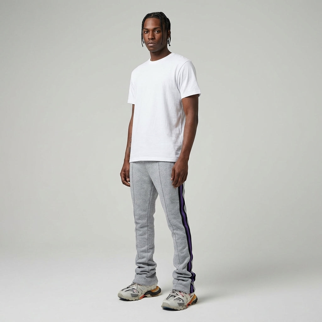 Urban Flare Joggers in gray with purple side stripes, worn by a model standing against a neutral background.