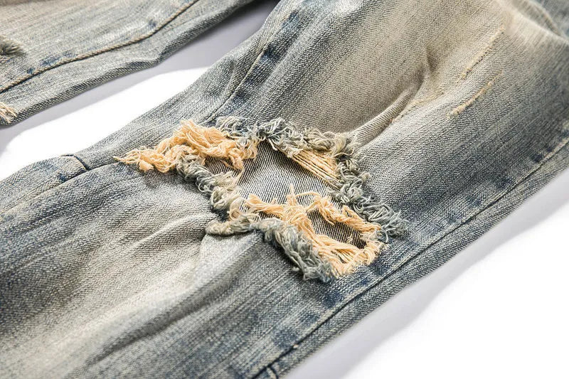 Shatter Fade Zippered Destroyed Jeans – Light Blue Ripped Streetwear Denim, Inner Zipper Detail, GOAT Streetwear Essentials