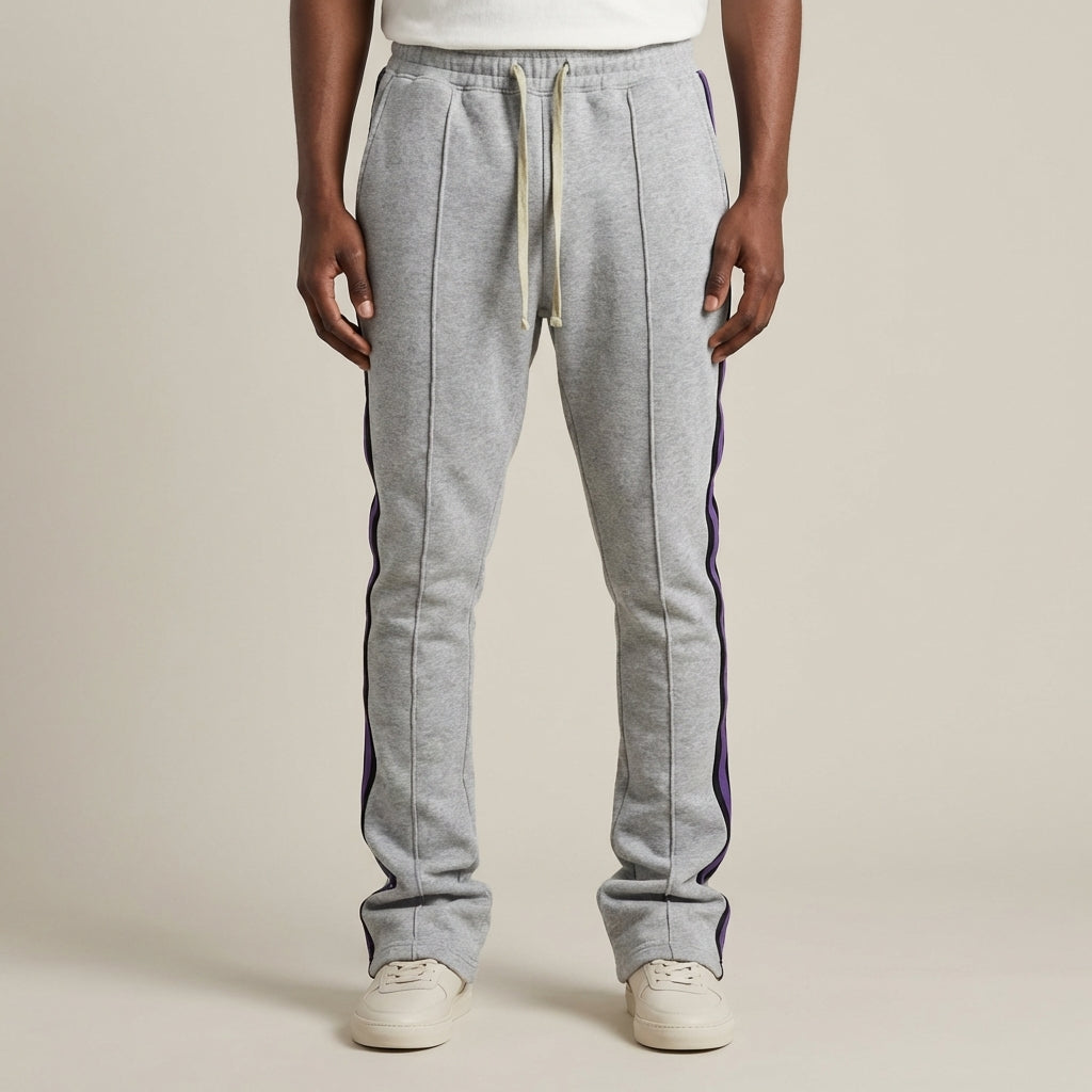 Urban Flare Joggers in light gray with purple side stripes, featuring a relaxed fit and elastic waistband.