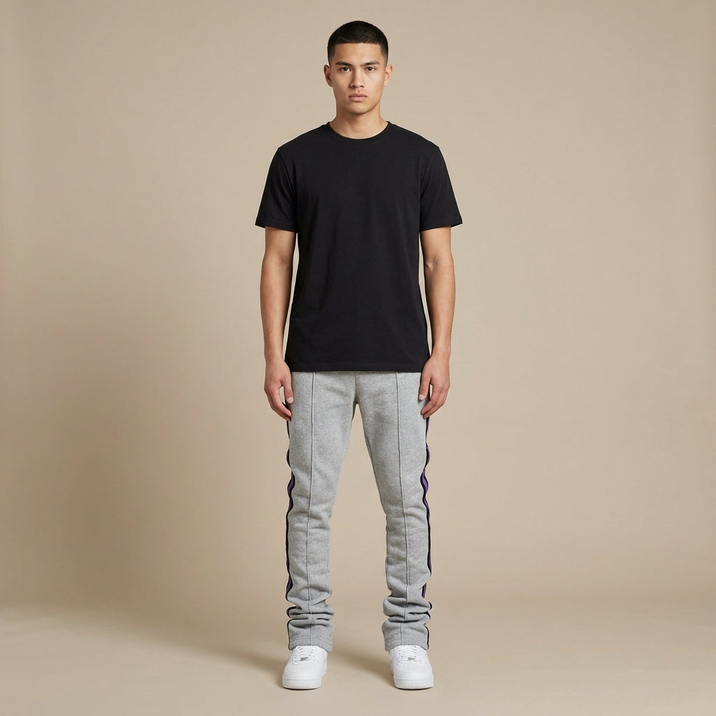 Urban Flare Joggers in gray with purple side stripes, worn by a model standing against a neutral background.
