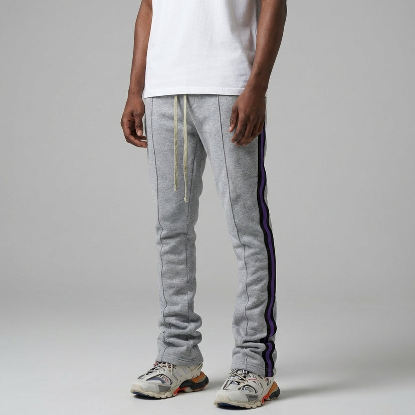 Urban Flare Joggers in light gray with purple side stripes, worn by a model standing against a neutral background.